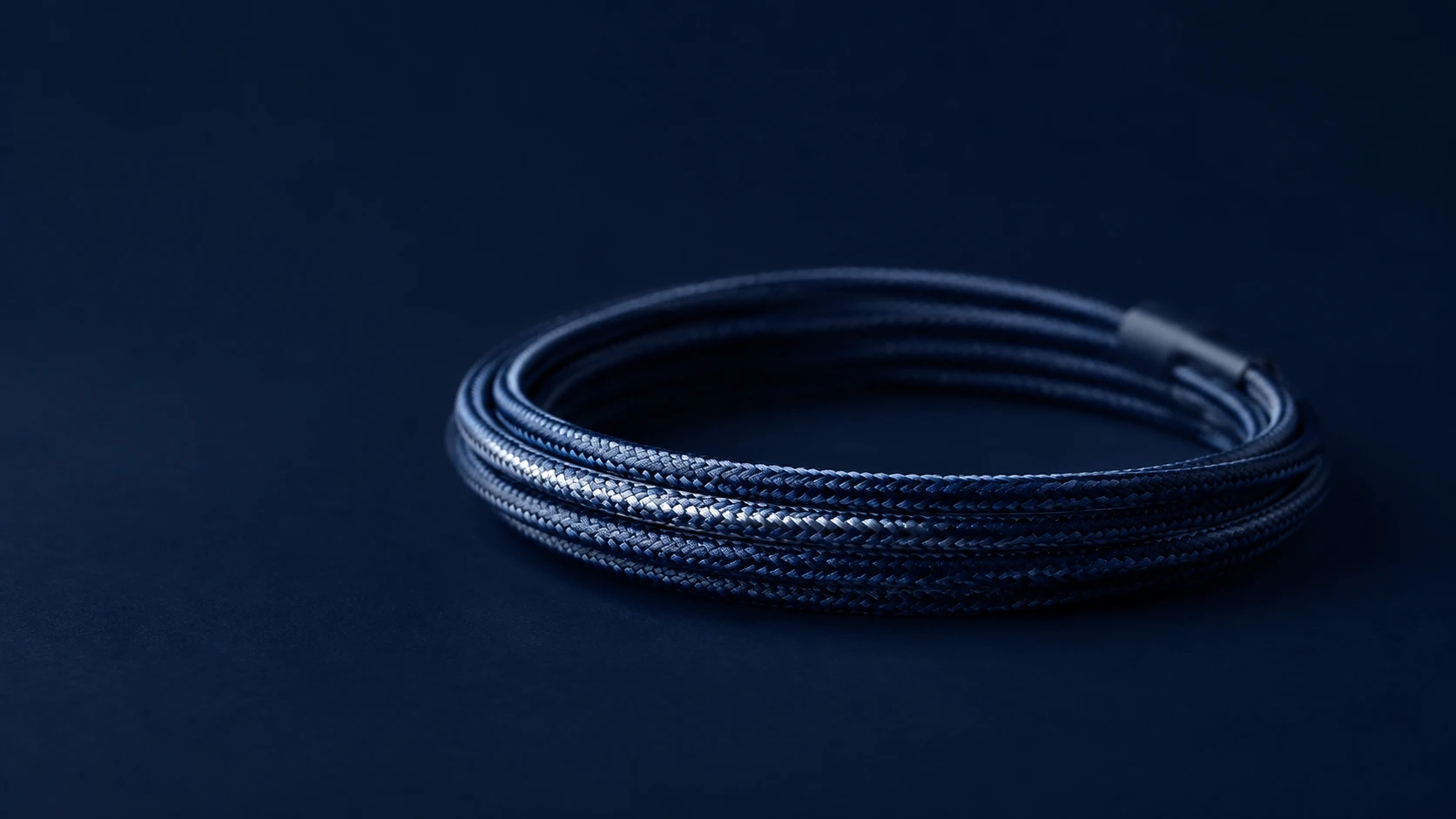 A single coiled braided cable — one accountable UK team for IT support and web development